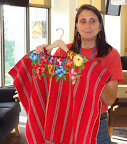 Phyllis Terwiliger displays colorful clothing from Latin America.